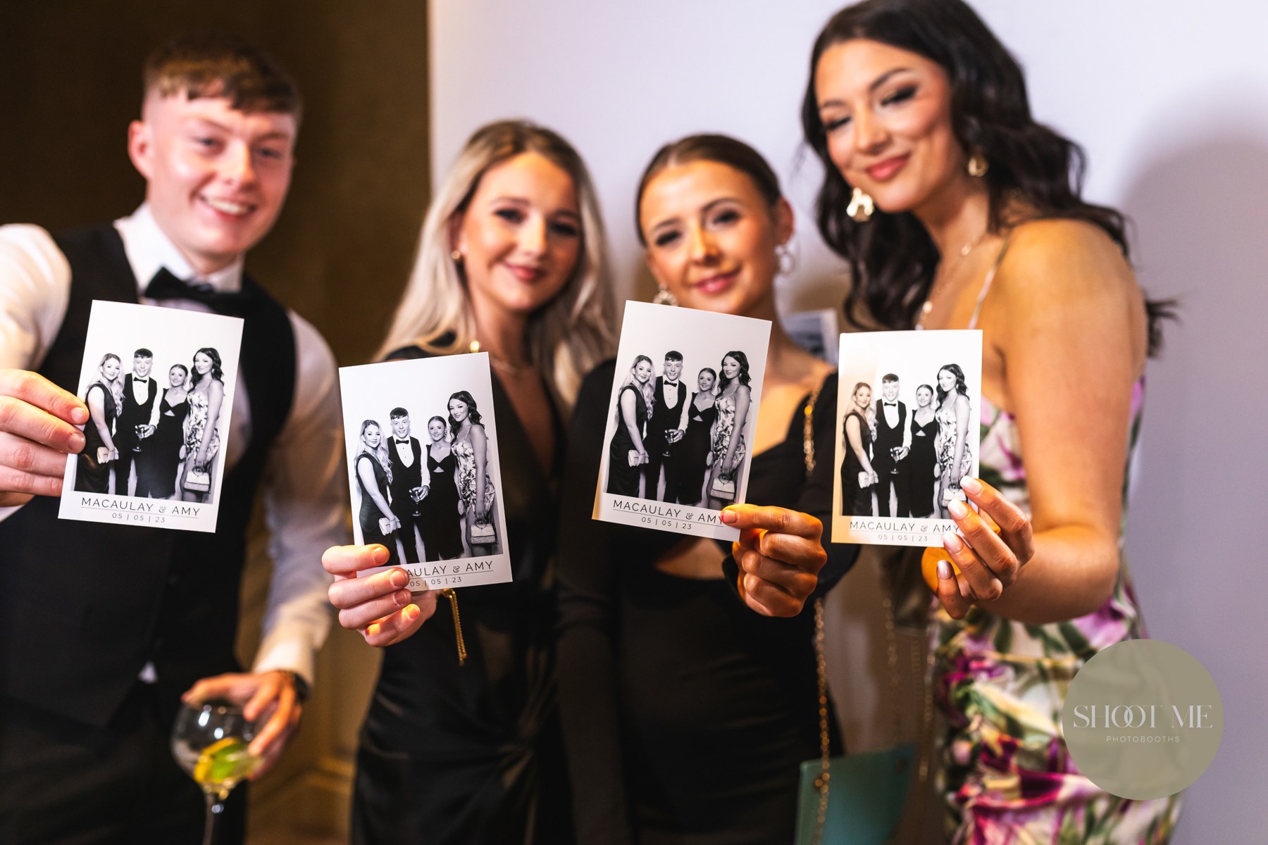 Friends sharing their printed wedding memories