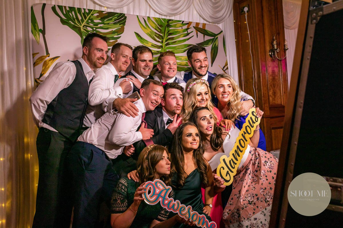 Wedding guests enjoying the photobooth